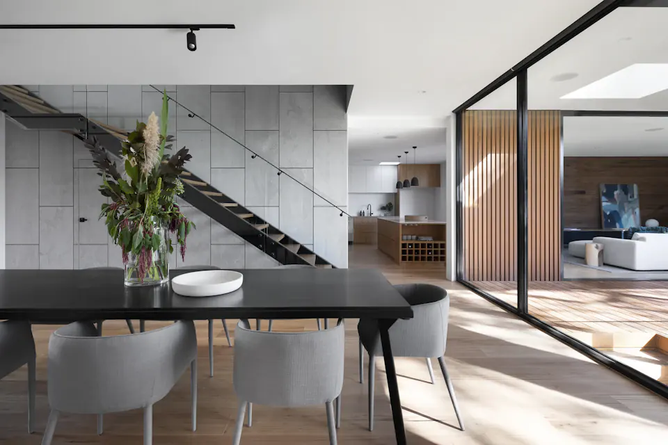 Quiet contemporary living space with warm natural finishes